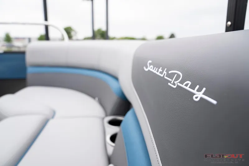 Slide: The Image of 2023 South Bay RearSeating 200hp boat with luxurious seating and cup holders. - 6