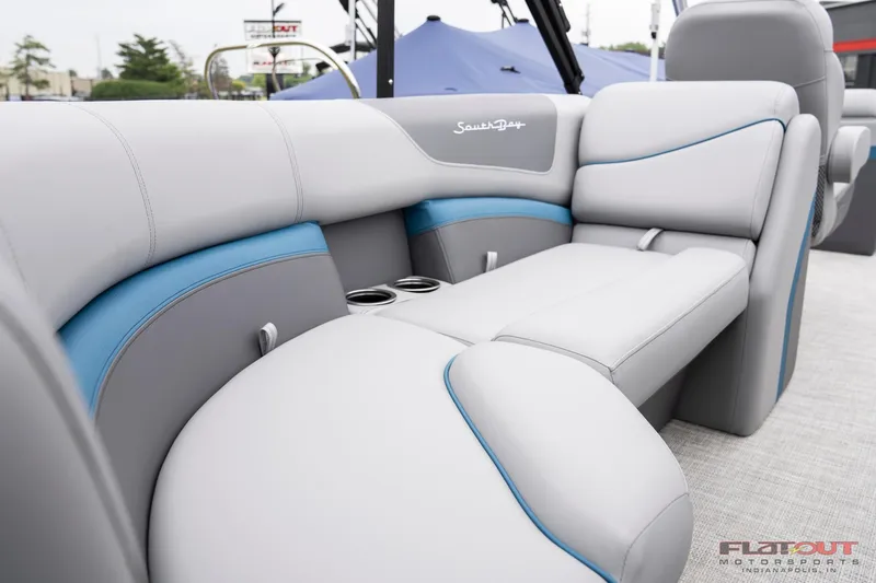 Slide: The Image of 2023 South Bay RearSeating 200hp boat with luxurious gray and blue upholstery. - 7
