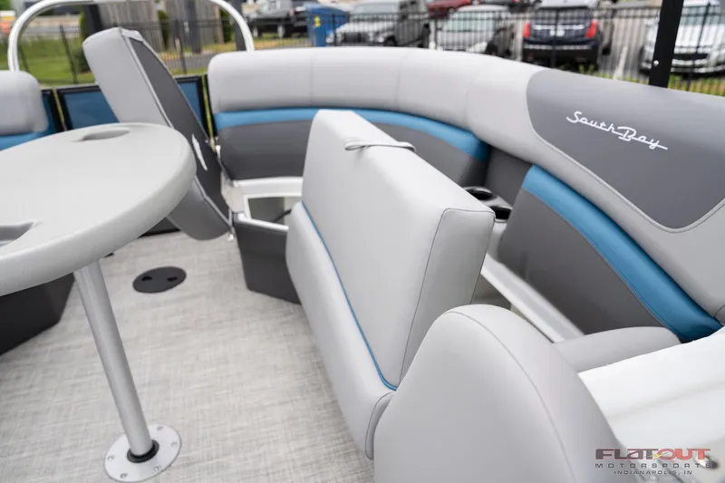 Slide: The Image of 2023 South Bay RearSeating 200hp boat interior with gray and blue upholstery. - 8