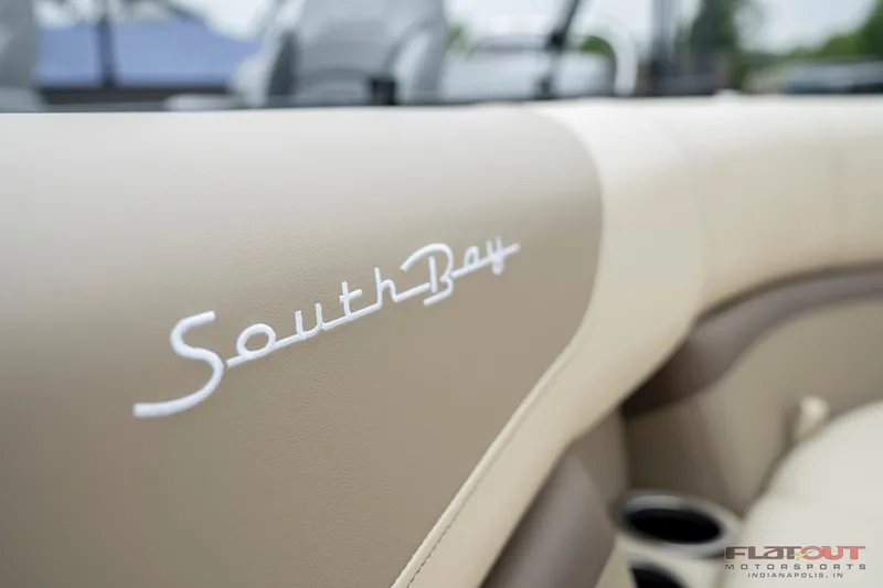 Slide: The Image of 2023 South Bay RearSeating 200hp boat interior with beige leather upholstery. - 10
