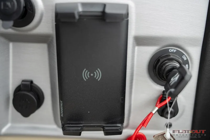 Slide: The Image of 2023 South Bay RearSeating 200hp dashboard with wireless charging dock and ignition switch. - 15