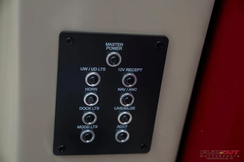 Slide: The Image of Control panel of a 2023 South Bay RearSeating 200hp boat. - 18