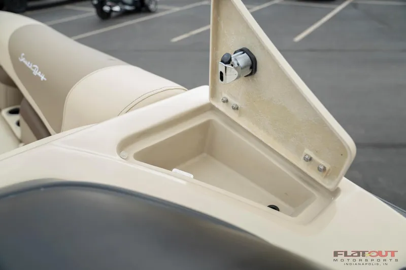 Slide: The Image of 2023 South Bay RearSeating 200hp boat storage compartment with open lid. - 19
