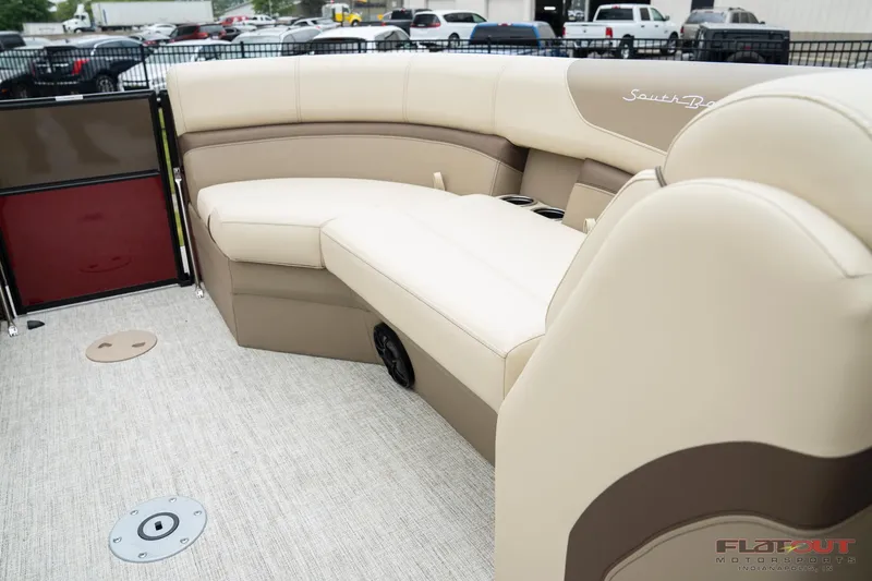 Slide: The Image of 2023 South Bay RearSeating 200hp boat with luxurious beige and brown seating. - 2