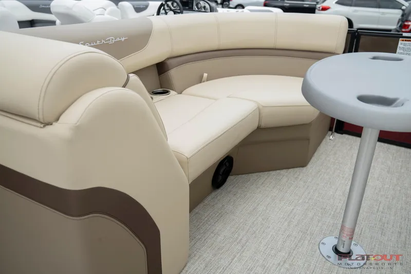 Slide: The Image of 2023 South Bay RearSeating 200hp boat with beige and brown cushioned seating. - 22