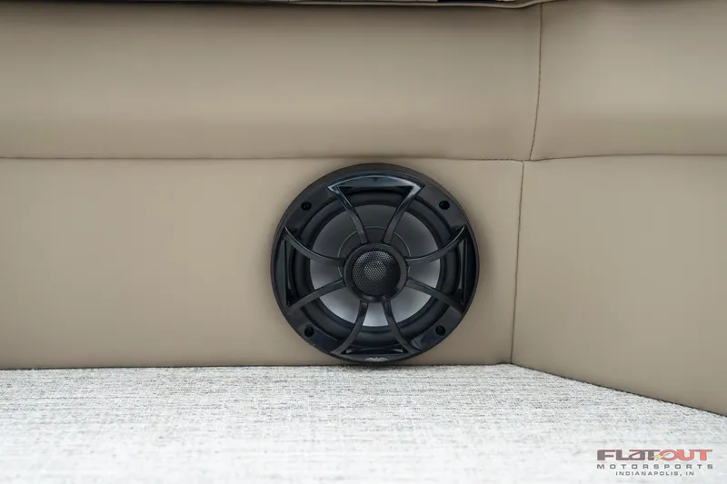 Slide: The Image of Speaker installed in the seating area of a 2023 South Bay RearSeating 200hp boat. - 23