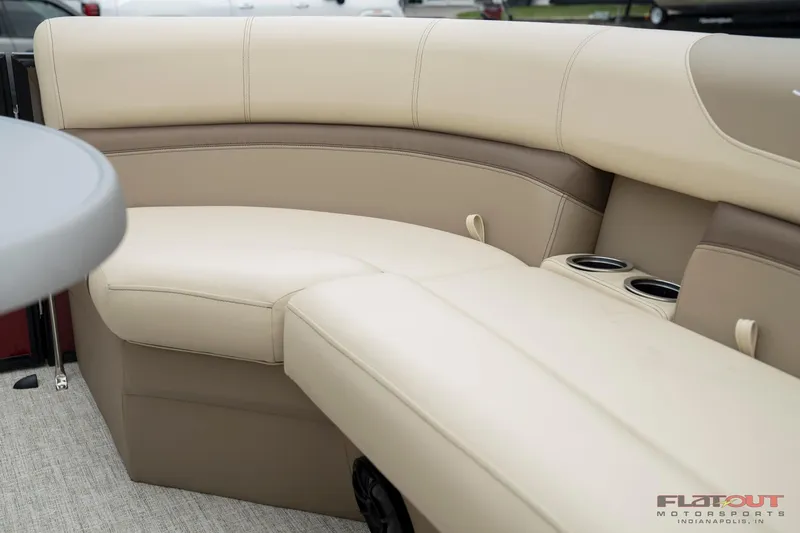 Slide: The Image of 2023 South Bay RearSeating 200hp boat with beige and brown cushioned seating. - 24