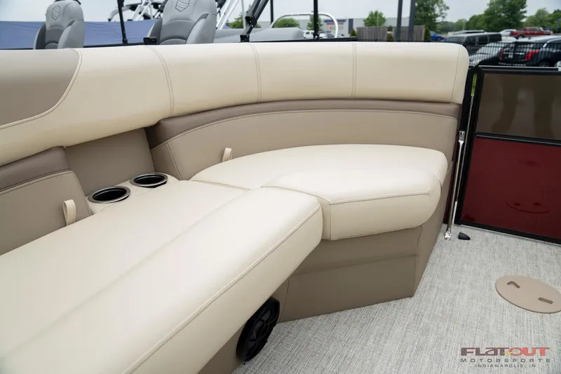 Slide: The Image of 2023 South Bay RearSeating 200hp boat with beige leather seats and cup holders. - 3