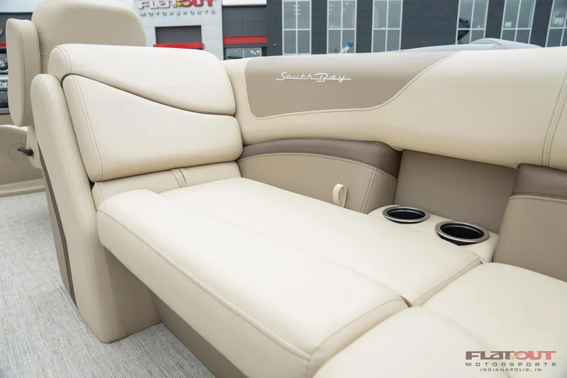Slide: The Image of 2023 South Bay RearSeating 200hp boat with beige and brown leather seats. - 4