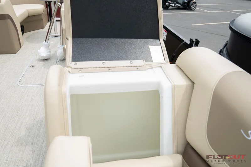 Slide: The Image of 2023 South Bay RearSeating 200hp boat with open storage compartment. - 6