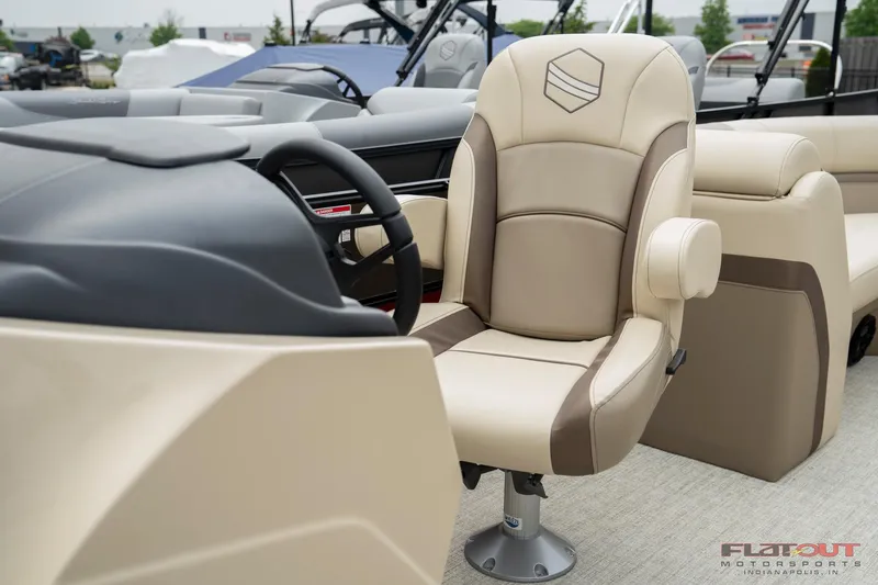 Slide: The Image of 2023 South Bay RearSeating 200hp boat interior with captain's chair and steering wheel. - 9