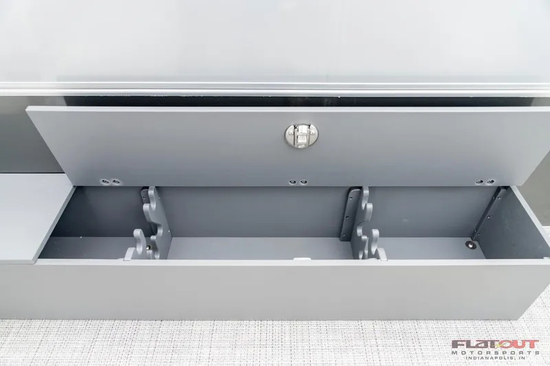 Slide: The Image of 2023 South Bay S224 Cruise & Fish 200HP storage compartment with rod holders. - 19