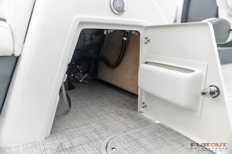 Slide: The Image of Open storage compartment on a 2023 South Bay S224 Cruise & Fish 200HP boat. - 22