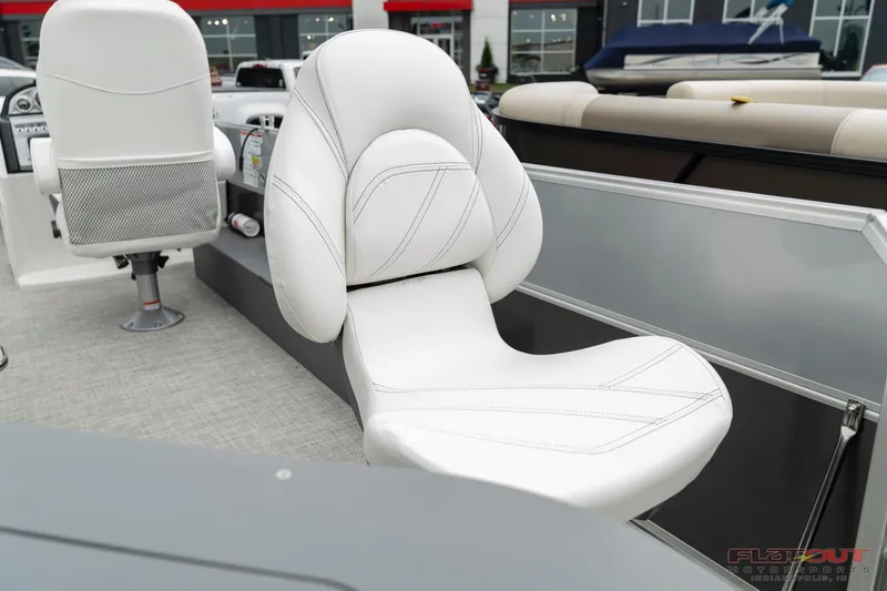 Slide: The Image of 2023 South Bay S224 Cruise & Fish 200HP boat with white cushioned seating. - 24