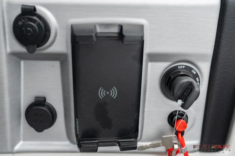 Slide: The Image of Control panel of 2023 South Bay S224 Cruise & Fish 200HP boat with ignition and charging ports. - 30