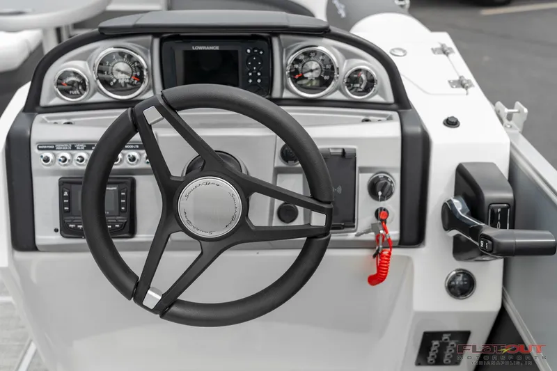 Slide: The Image of 2023 South Bay S224 Cruise & Fish 200HP boat dashboard with steering wheel and controls. - 32