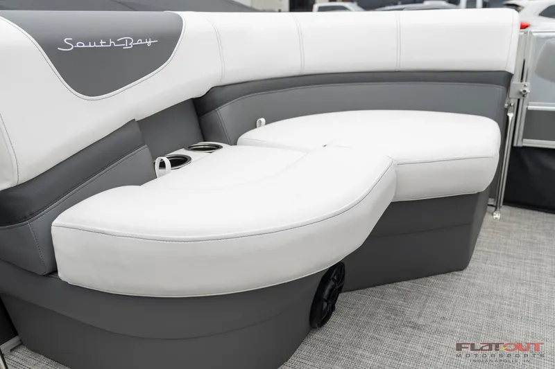 Slide: The Image of 2023 South Bay S224 Cruise & Fish 200HP boat interior with white and gray seating. - 6