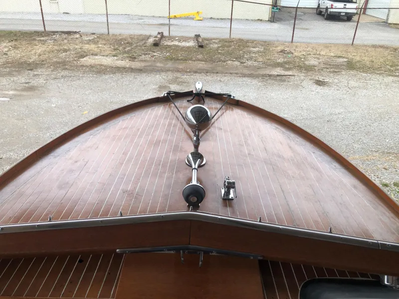 Slide: The Image of 1960 Chris-Craft 24 Sportsman wooden boat deck with chrome fixtures. - 10