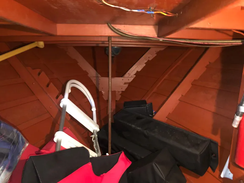 Slide: The Image of Interior of a 1960 Chris-Craft 24 Sportsman boat with storage items. - 12