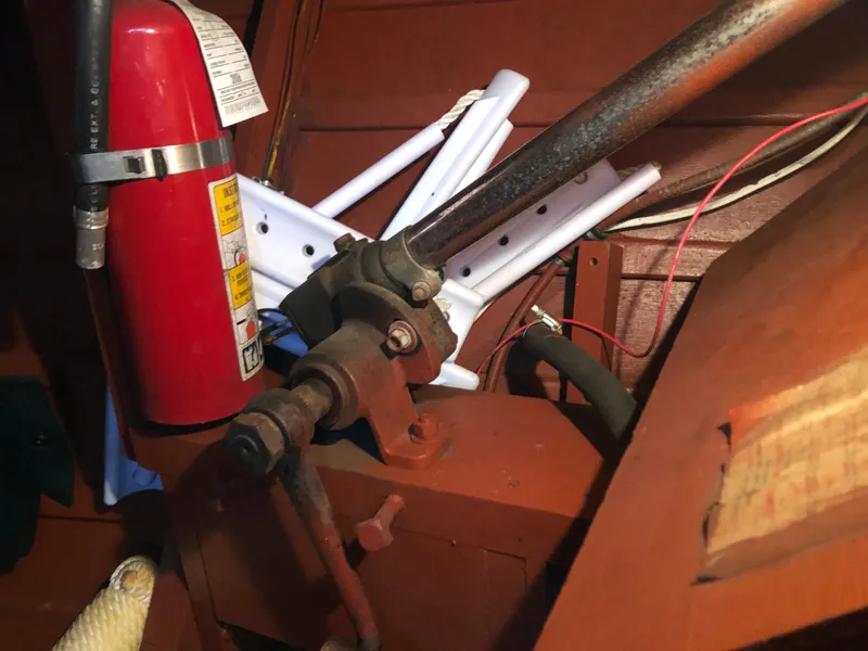 Slide: The Image of 1960 Chris-Craft 24 Sportsman interior with fire extinguisher and mechanical components. - 13