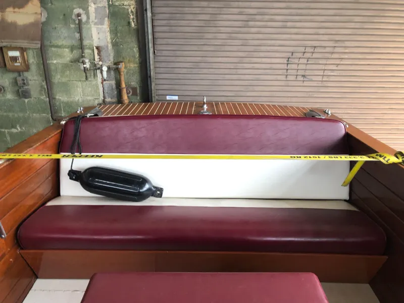 Slide: The Image of 1960 Chris-Craft 24 Sportsman boat interior with red and white seating. - 17