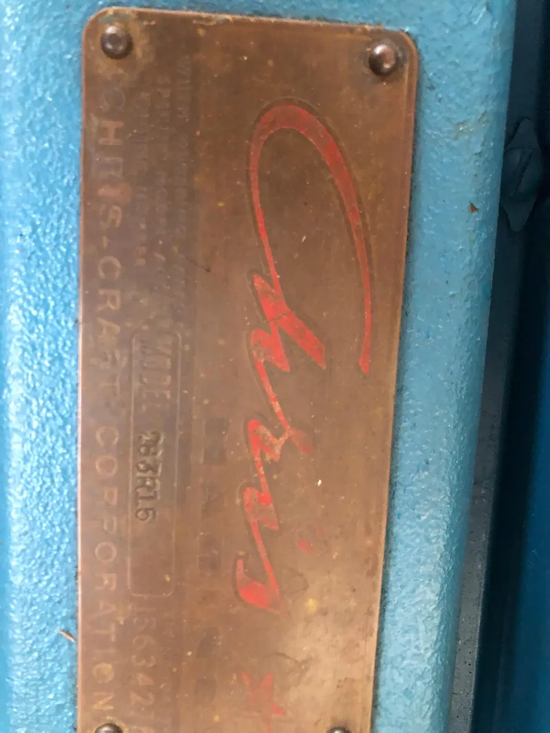 Slide: The Image of 1960 Chris-Craft 24 Sportsman brass nameplate on blue background. - 20