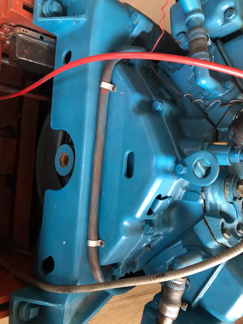 Slide: The Image of Close-up of a 1960 Chris-Craft 24 Sportsman engine in blue. - 21