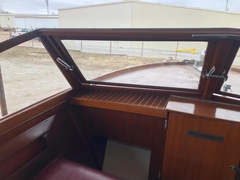 Slide: The Image of Interior view of a 1960 Chris-Craft 24 Sportsman boat with wooden dashboard. - 7