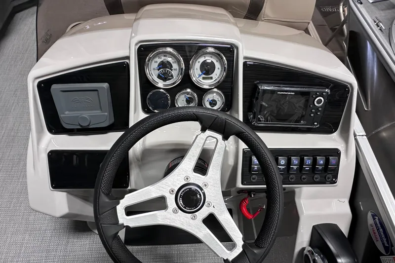 Slide: The Image of 2026 Sylvan Mirage 820 LZ dashboard with steering wheel and control panel. - 10