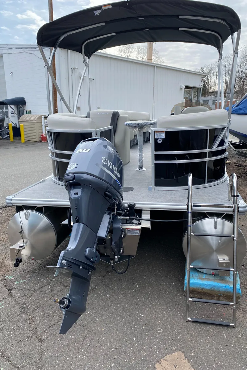 Slide: The Image of 2026 Sylvan Mirage 820 LZ pontoon boat with outboard motor. - 8