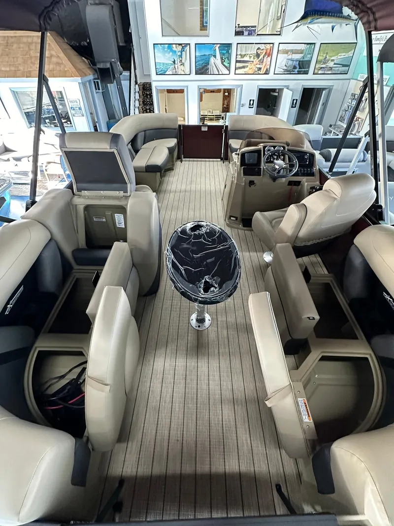 Slide: The Image of Luxurious 2025 Sylvan Mirage X1 pontoon boat interior with plush seating and modern design. - 7