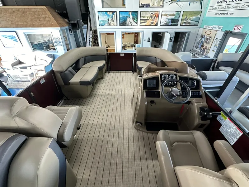 Slide: The Image of Interior of 2025 Sylvan Mirage X1 boat with luxurious seating and modern design. - 8