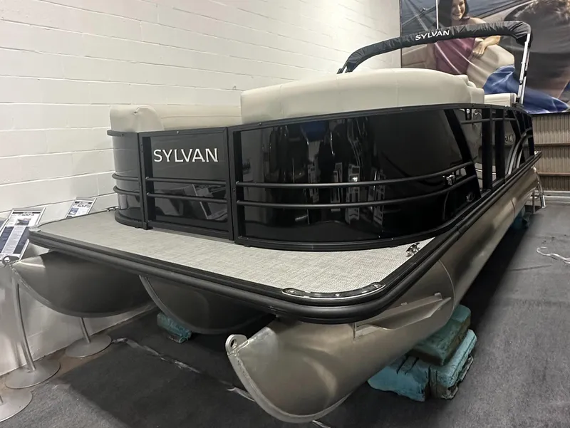 The Image of 2025 Sylvan Mirage X3 CLZ DH pontoon boat displayed indoors. - 0