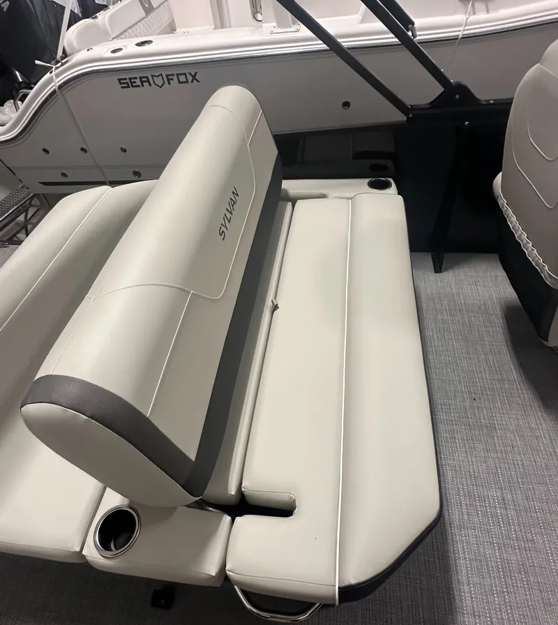 Slide: The Image of 2025 Sylvan Mirage X3 CLZ DH boat seat storage compartment with sleek design and ample space. - 10