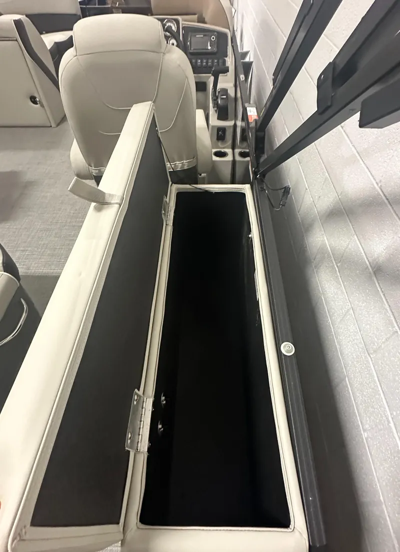 Slide: The Image of 2025 Sylvan Mirage X3 CLZ DH boat interior with gray seating and cup holders. - 11