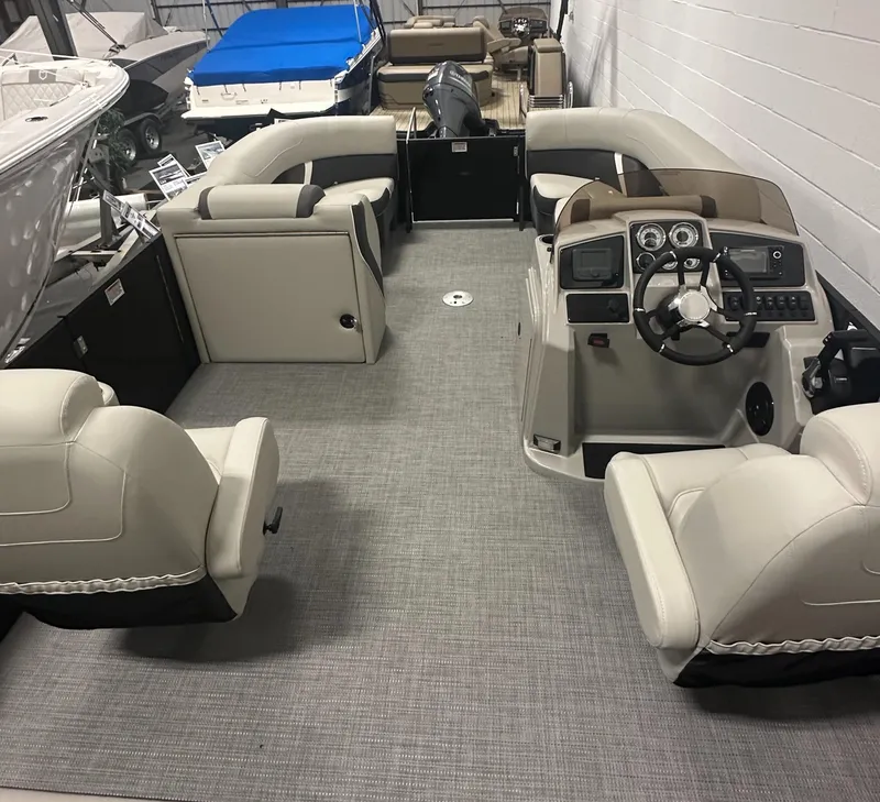 Slide: The Image of 2025 Sylvan Mirage X3 CLZ DH boat interior with open storage compartment. - 12