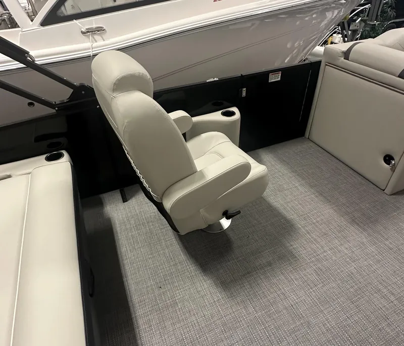 Slide: The Image of 2025 Sylvan Mirage X3 CLZ DH pontoon boat interior with modern seating and helm. - 13