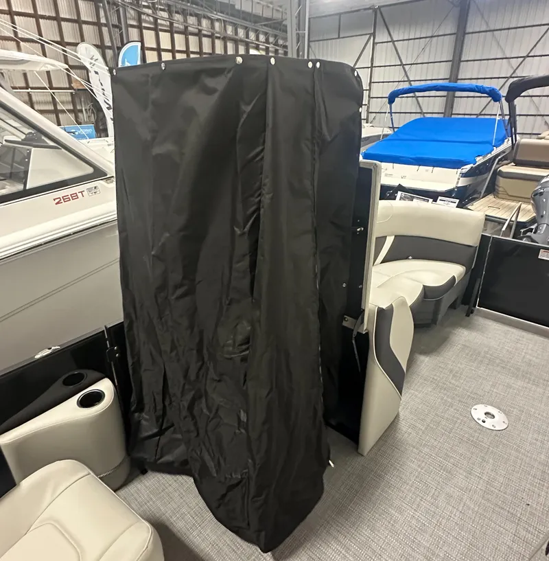 Slide: The Image of 2025 Sylvan Mirage X3 CLZ DH boat interior with plush seating and modern design. - 14