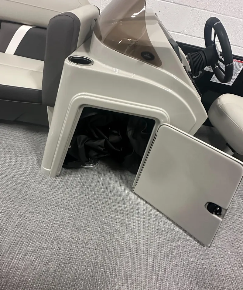 Slide: The Image of 2025 Sylvan Mirage X3 CLZ DH boat dashboard with steering wheel and controls. - 17