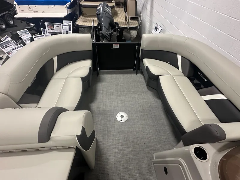Slide: The Image of 2025 Sylvan Mirage X3 CLZ DH boat interior with open storage compartment. - 18