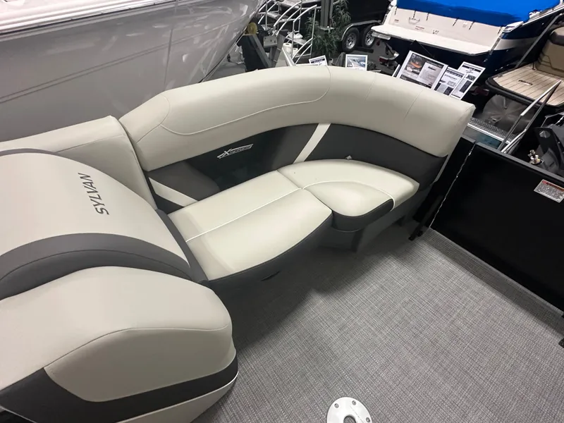 Slide: The Image of 2025 Sylvan Mirage X3 CLZ DH pontoon boat interior with plush seating and modern design. - 19