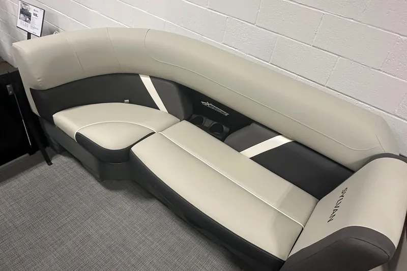 Slide: The Image of 2025 Sylvan Mirage X3 CLZ DH boat interior with storage compartment and seating. - 21