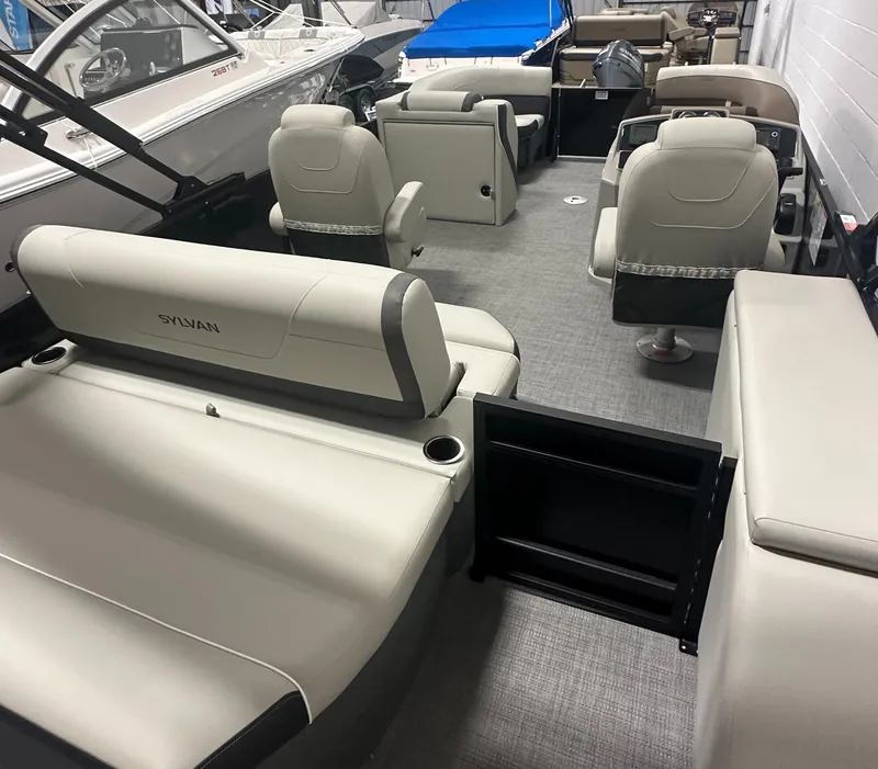 Slide: The Image of 2025 Sylvan Mirage X3 CLZ DH pontoon boat interior with seating and storage. - 5