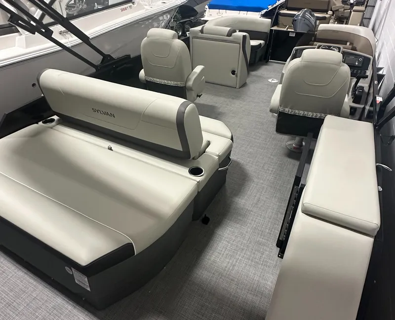 Slide: The Image of 2025 Sylvan Mirage X3 CLZ DH pontoon boat interior with luxurious seating and modern design. - 6