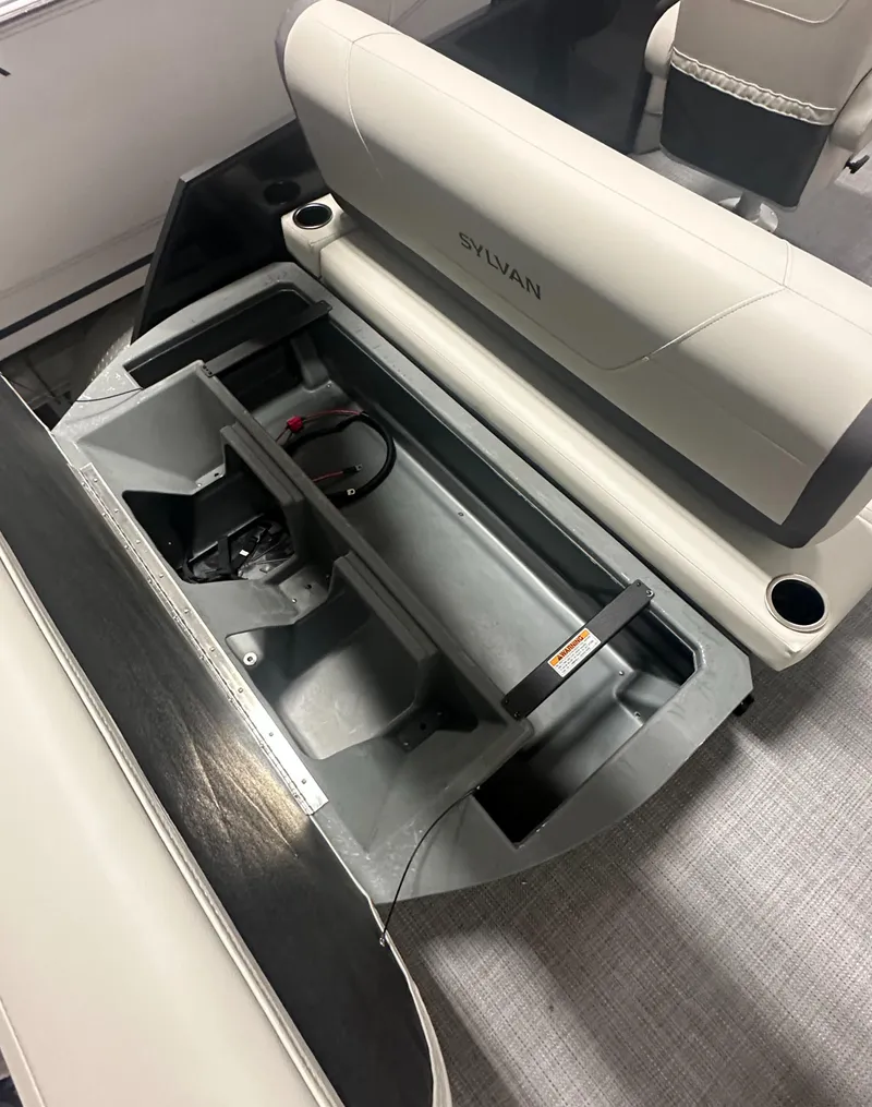 Slide: The Image of 2025 Sylvan Mirage X3 CLZ DH boat interior with luxurious seating and cup holders. - 8