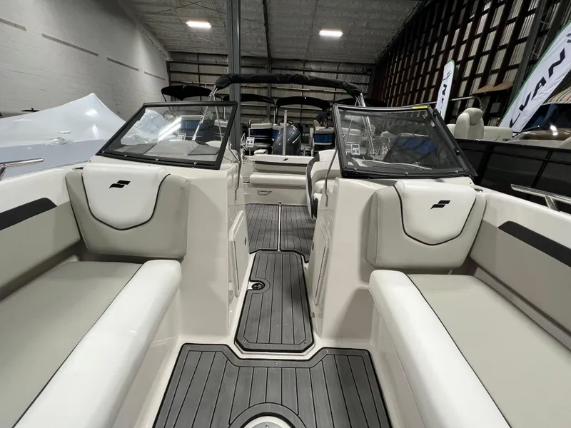 Slide: The Image of 2024 Starcraft SVX 210 OB boat interior with seating and windshield. - 12