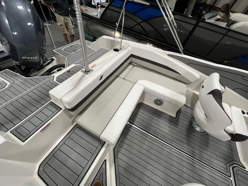 Slide: The Image of 2024 Starcraft SVX 210 OB boat interior with seating and deck view. - 7