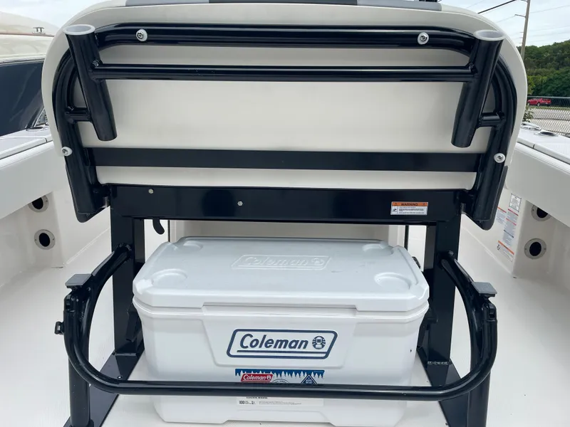 Slide: The Image of 2023 Robalo 266 Cayman boat with Coleman cooler storage. - 12