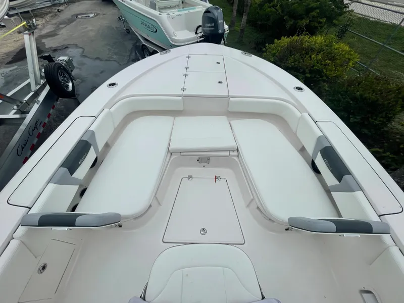 Slide: The Image of 2023 Robalo 266 Cayman boat with spacious seating and storage compartments. - 15
