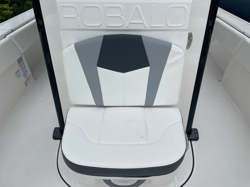 Slide: The Image of 2023 Robalo 266 Cayman boat seat with white and gray upholstery. - 19